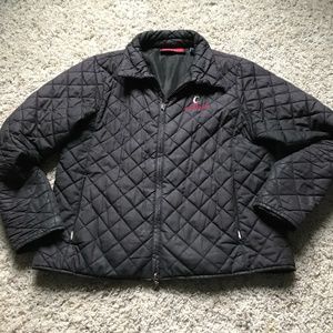 University of Cincinnati quilted jacket. Black with UC red emblem.